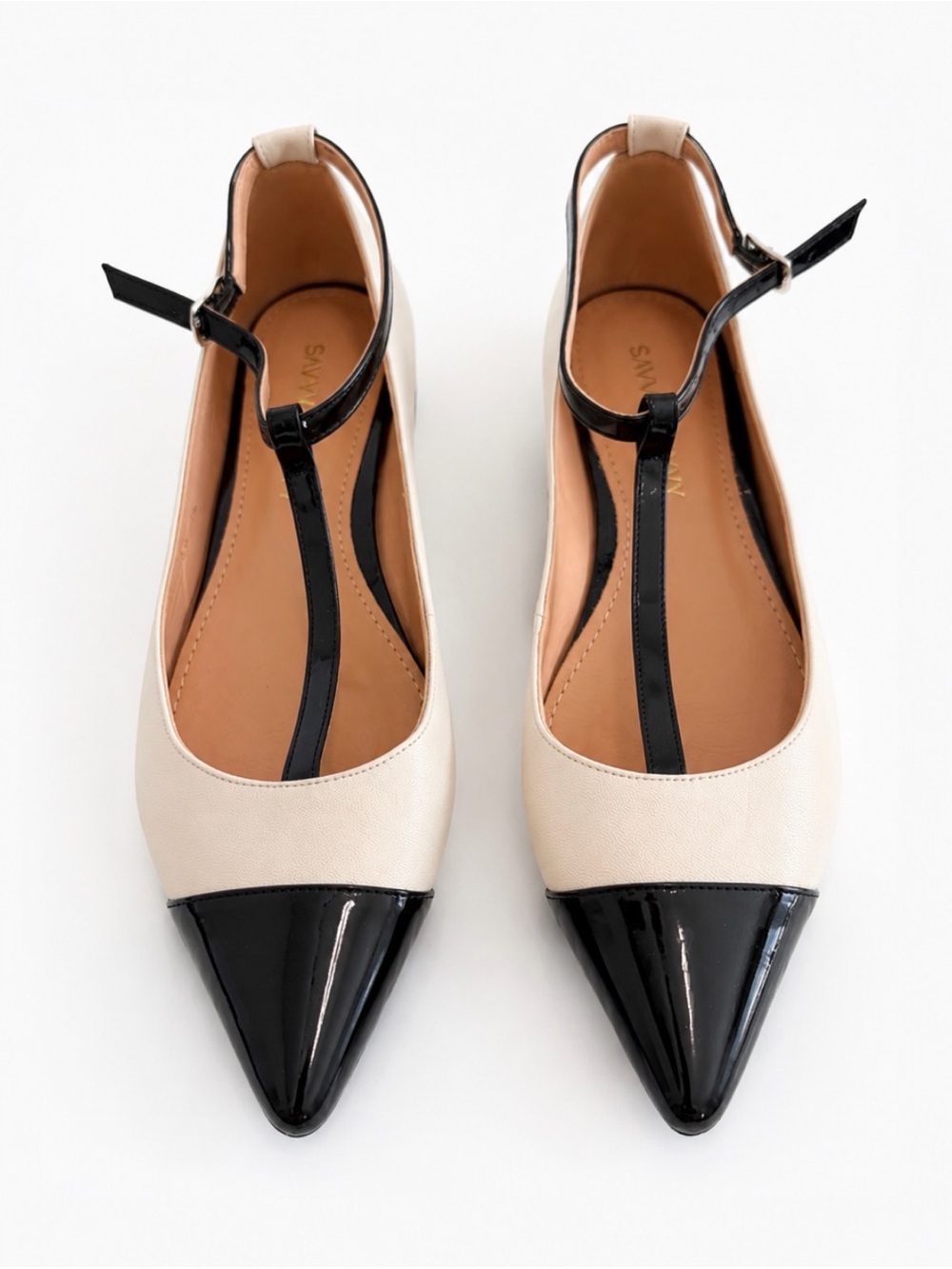 Savvy Two-Tone Pointed T-Strap Flats in Cream and Black